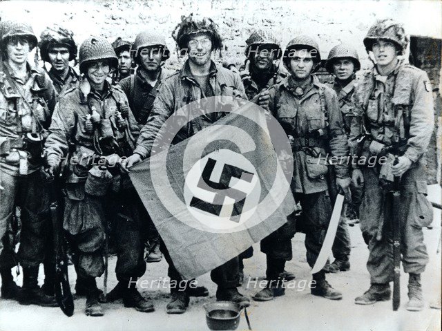 American parachute troops with a captured Nazi flag, Normandy, World War II, 6 June 1944. Artist: Unknown