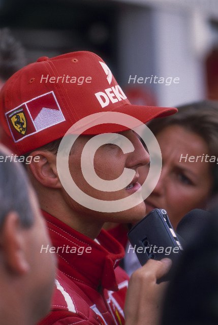 Michael Schumacher being interviewed, British Grand Prix, Silverstone, Northamptonshire, 1997. Artist: Unknown
