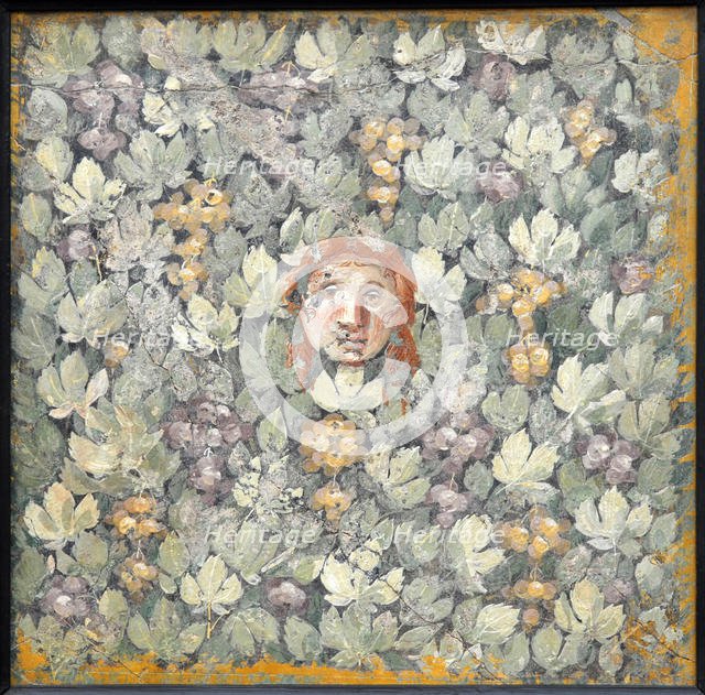 Mask on vine leaves and bunches of grapes, 1st H. 1st cen. AD. Creator: Roman-Pompeian wall painting.