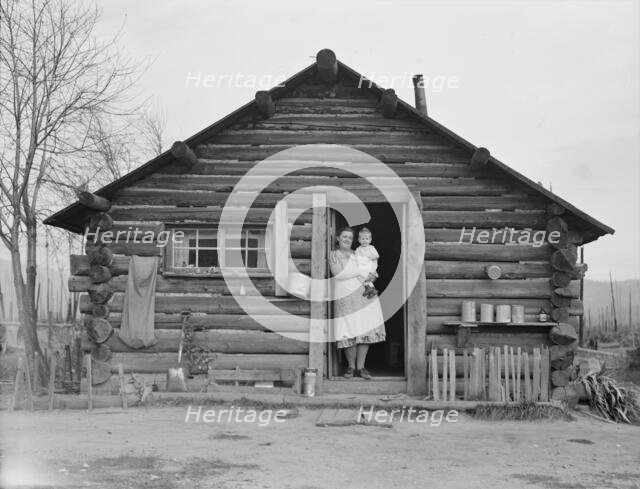 Log house now occupied and enlarged by the Halley family, Bonner County, Idaho, 1939. Creator: Dorothea Lange.