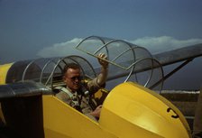 Marine glider pilot in training at Page Field, is watching take-offs, Parris Island, S.C., 1942. Creator: Alfred T Palmer.