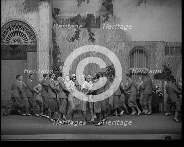 Scene from a Stage Show: Male and Female Civilians Dancing on a Stage in a Routine with..., 1929. Creator: British Pathe Ltd.