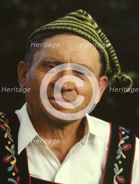 Guide at Little Norway, Blue Mounds, Wis., 1942. Creator: Arthur Rothstein.