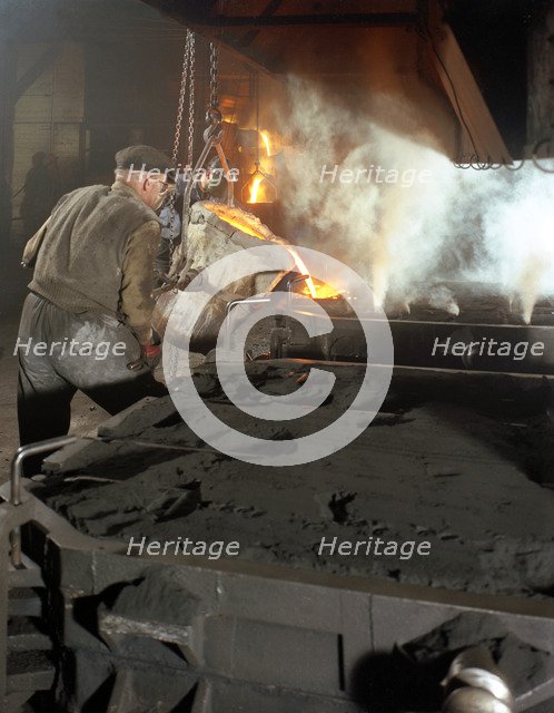 Pouring molten metal from a cupola into moulds, steel bath production, Hull, Humberside, 1965. Artist: Michael Walters