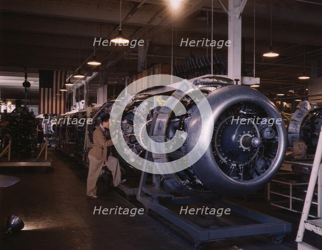 Cowling and control rods are added to motors for...North American Inc., Inglewood, Calif., 1942. Creator: Alfred T Palmer.