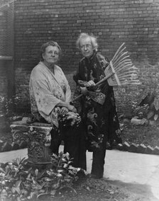 Frances B. Johnston in garden in New Orleans with "Pops" Whitesell, who is holding..., c1945 - 1952. Creator: Frances Benjamin Johnston.