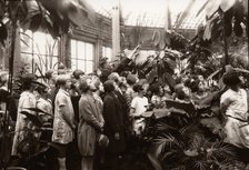 A group of girls are shown the features of a conservatory, York,  Yorkshire,  1929. Artist: Unknown