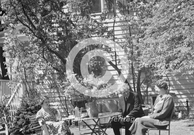Benson, Mary, Mrs., with Arnold Genthe and an unidentified woman seated ouside at..., c1933-c1942. Creator: Arnold Genthe.