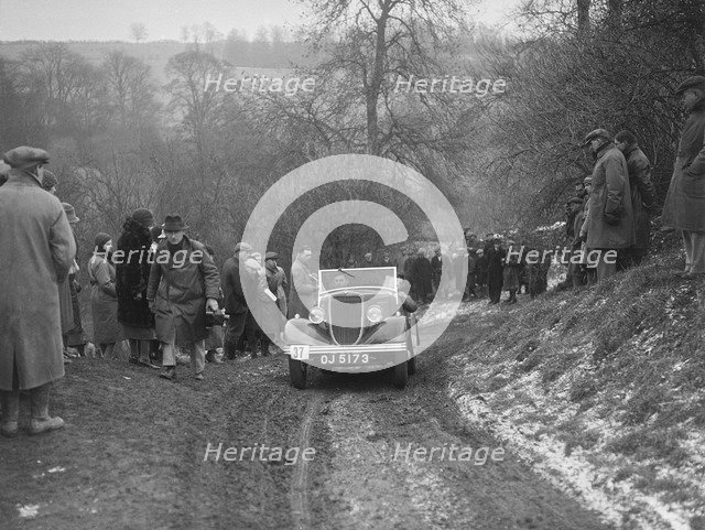 Ford V8 open tourer of H Hillcoat competing at the Sunbac Colmore Trial, Gloucestershire, 1933. Artist: Bill Brunell.