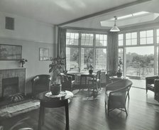 The sun lounge at Orchard House, Claybury Hospital, Woodford Bridge, London,1937. Artist: Unknown.