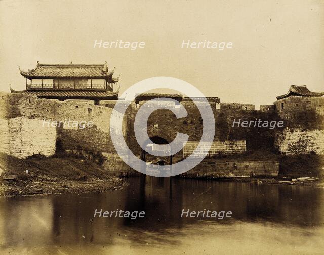 Walled River and Bridge with Buildings Above, 1860. Creator: Felice Beato.