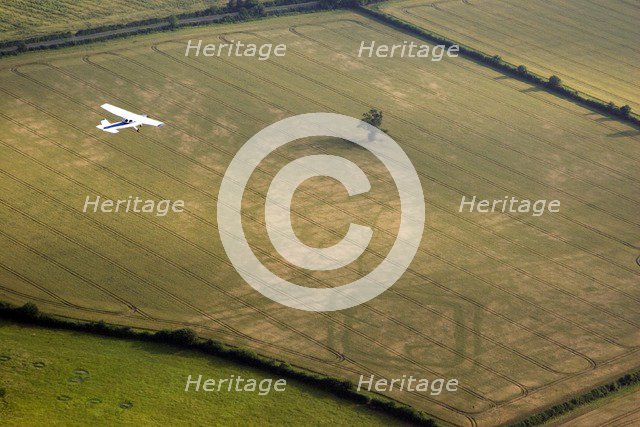 Aeroplane flying over Down Ampney, Gloucestershire, 2006. Artist: Peter Horne.