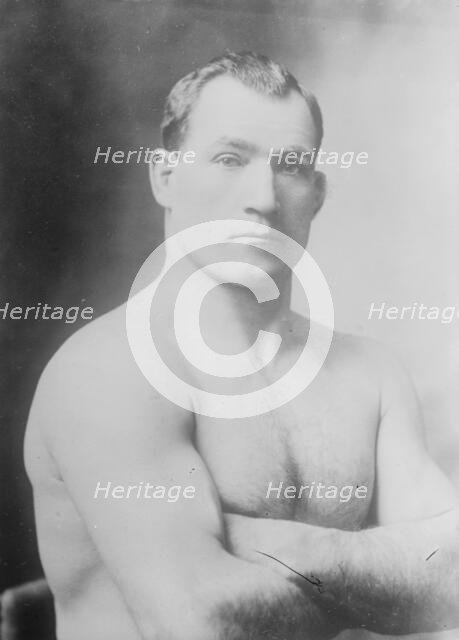 Tom Sharkey without shirt, 1910. Creator: Bain News Service.