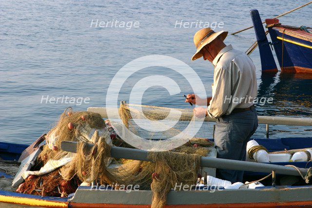 Man on board a fishing boat, Sami, Kefalonia, Greece