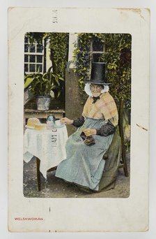 A Welsh woman at tea table with knitting on her lap, c1900. Creator: Unknown.