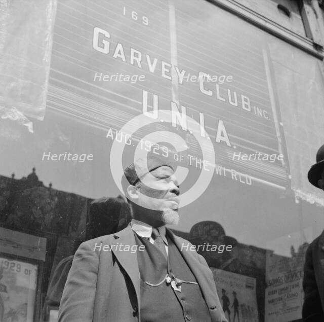 A follower of the late Marcus Garvey who started the "Back to Africa" movement, New York, 1943. Creator: Gordon Parks.