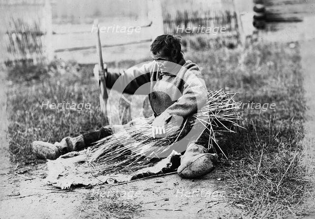 Hammering the sheaf, 1890.  Creator: Unknown.