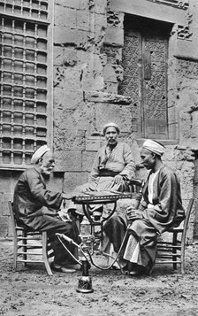 Men relaxing, Cairo, Egypt, c1922. Artist: Donald McLeish