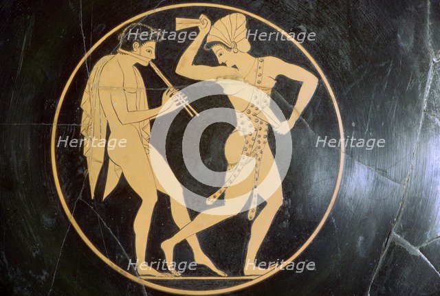 Vase-painting of a youth playing the flute and a woman dancing, 6th century BC. Artist: Epikektos
