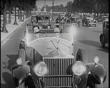 Scene from the Film 'The Compulsory Husband': The Actor Monty Banks Driving a Car With..., 1920s. Creator: British Pathe Ltd.