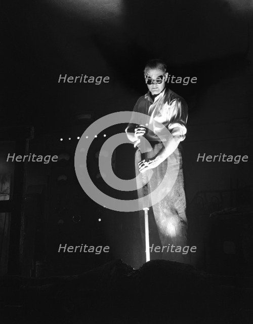 Furnace feeding in the Steel City, Sheffield, South Yorkshire, 1963. Artist: Michael Walters