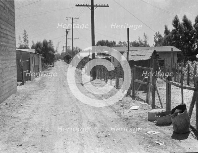 The slums of Brawley, Homes of Mexican field workers, Imperial Valley, California, 1935. Creator: Dorothea Lange.