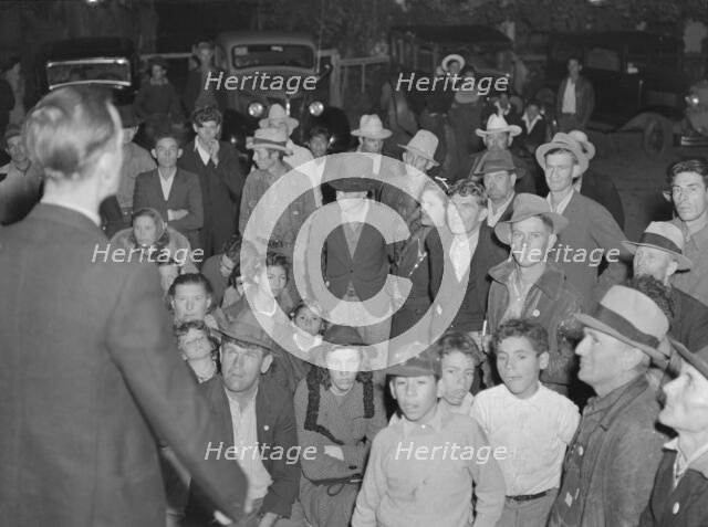 Night street meeting of cotton strikers near end of defeated strike. Kern County, California, 1939. Creator: Dorothea Lange.