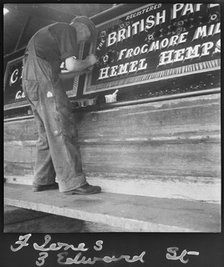Barge painter Frank Jones, of 3 Edward Street, at work, Leighton Buzzard, Bedfordshire, 1910-60. Creator: George R Long.