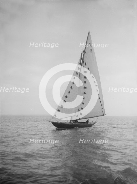 The 7 Metre sailing yacht 'Pinaster' (K8) with prize flags, 1912. Creator: Kirk & Sons of Cowes.