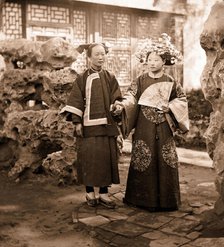 China: a Manchu bride in her wedding clothes with her maid, Beijing, 1869. Creator: John Thomson.