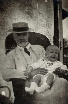Anton Freiherr von Eiselsberg with a baby. Creator: Unknown.