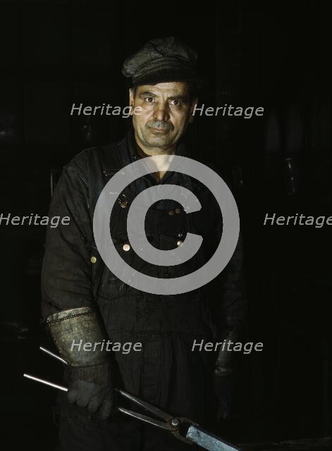 Daniel Anastazia, blacksmith's helper, Rock Island R.R., Blue Island, Ill., 1943. Creator: Jack Delano.