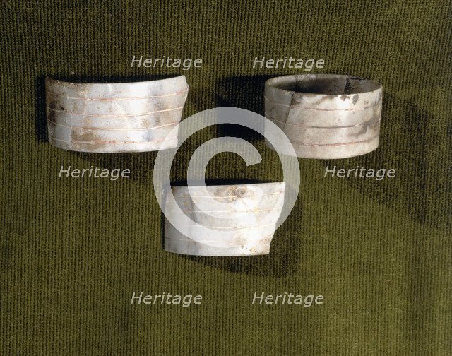 Marble bracelets decorated with parallel carved lines, from the Bat Cave, Zuheros (Córdoba).