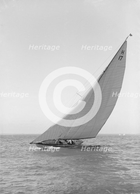 The 8 Metre 'Ierne' (H17) sailing close-hauled, 1914. Creator: Kirk & Sons of Cowes.