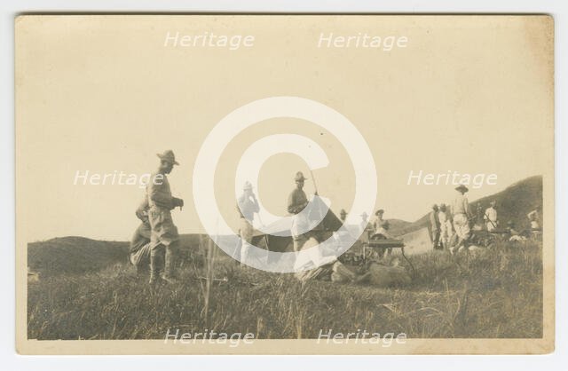 Photographic postcard of Charles Wilbur Rogan with his unit in the Philippines, 1910-1919. Creator: Unknown.