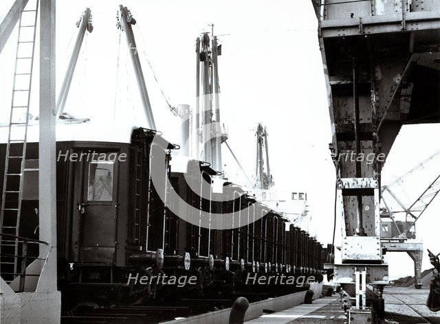 Loading and transport of train wagons in the port of Zeebrugge - Bruges, Belgium.