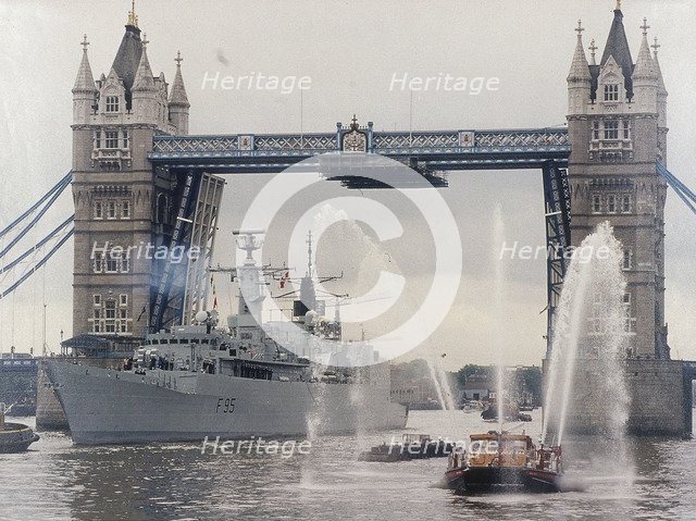 View of HMS London sailing beneath Tower Bridge, London, 1988. Artist: Anon