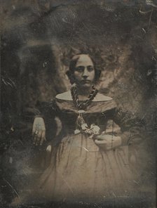 Young woman holding a flower, ca. 1842. Creator: Joseph Philibert Girault De Prangey.