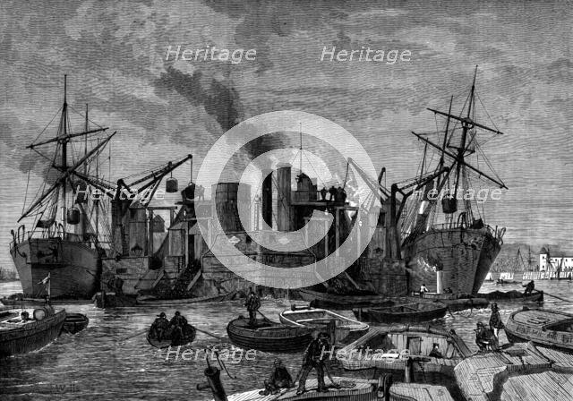 Screw colliers unloading in the Thames, 1873. Creator: Unknown.