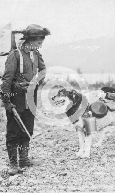 Prospector and dog ready for the summer trail, between c1900 and c1930. Creator: Unknown.