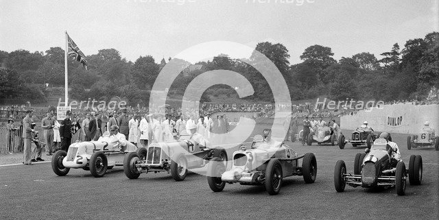 MG R type of Bill Esplen, ERA of Geg Parnell and MG of H Stuart-Wilton, Crystal Palace, 1939. Artist: Bill Brunell.