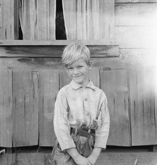 The youngest Arnold boy who also works at land clearing, Michigan Hill, Western Washington, 1939. Creator: Dorothea Lange.