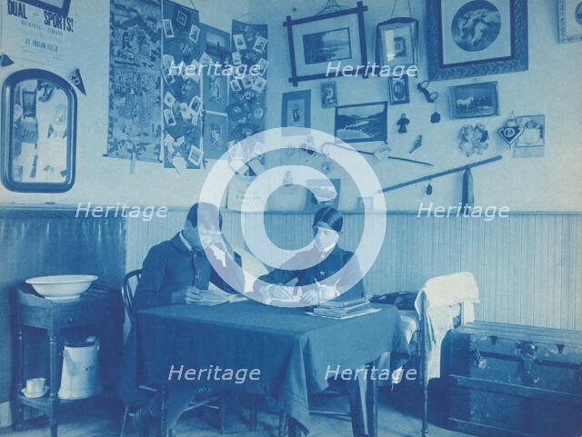 Carlisle Indian School, Carlisle, Pa. Two boys studying in dormitory room, 1901. Creator: Frances Benjamin Johnston.