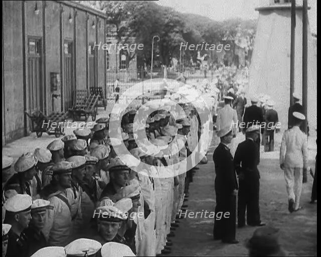 Male German Navy Crew Lined up in Front of a Building in Montevideo, 1939. Creator: British Pathe Ltd.