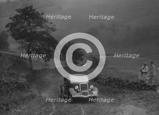 Ford V8 saloon of WS Millar competing in the MCC Sporting Trial, 1935. Artist: Bill Brunell.