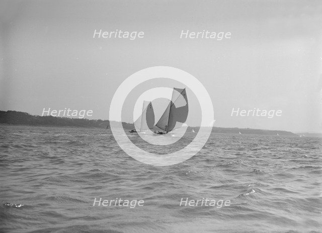 The 8 Metre sailing yachts 'Endrick' and 'Spero' racing downwind, 1911. Creator: Kirk & Sons of Cowes.