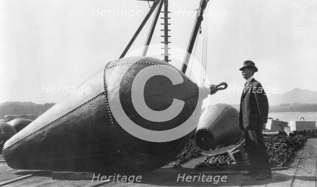Frank G. Carpenter on lighthouse wharf, Ketchikan, 1915. Creator: Unknown.
