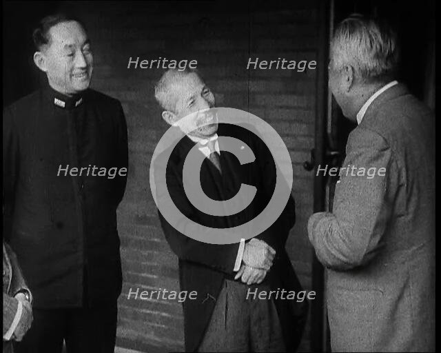A Group of Four Male Japanese Politicians Talking Animatedly, 1937. Creator: British Pathe Ltd.