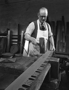 Tensioning the crosscut on a two metre saw blade, Sheffield, South Yorkshire, 1963. Artist: Michael Walters