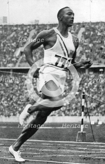 Jesse Owens at the end of the 100m at the Berlin Olympic Games, 1936. Artist: Unknown